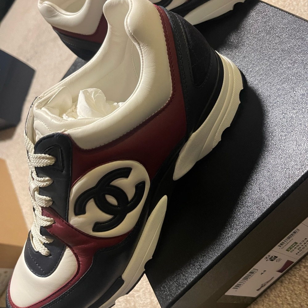 CHANEL Black and White Sneakers with Iconic Logo